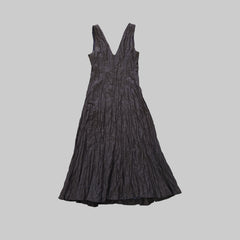 Dark gray dress on a tiled floor