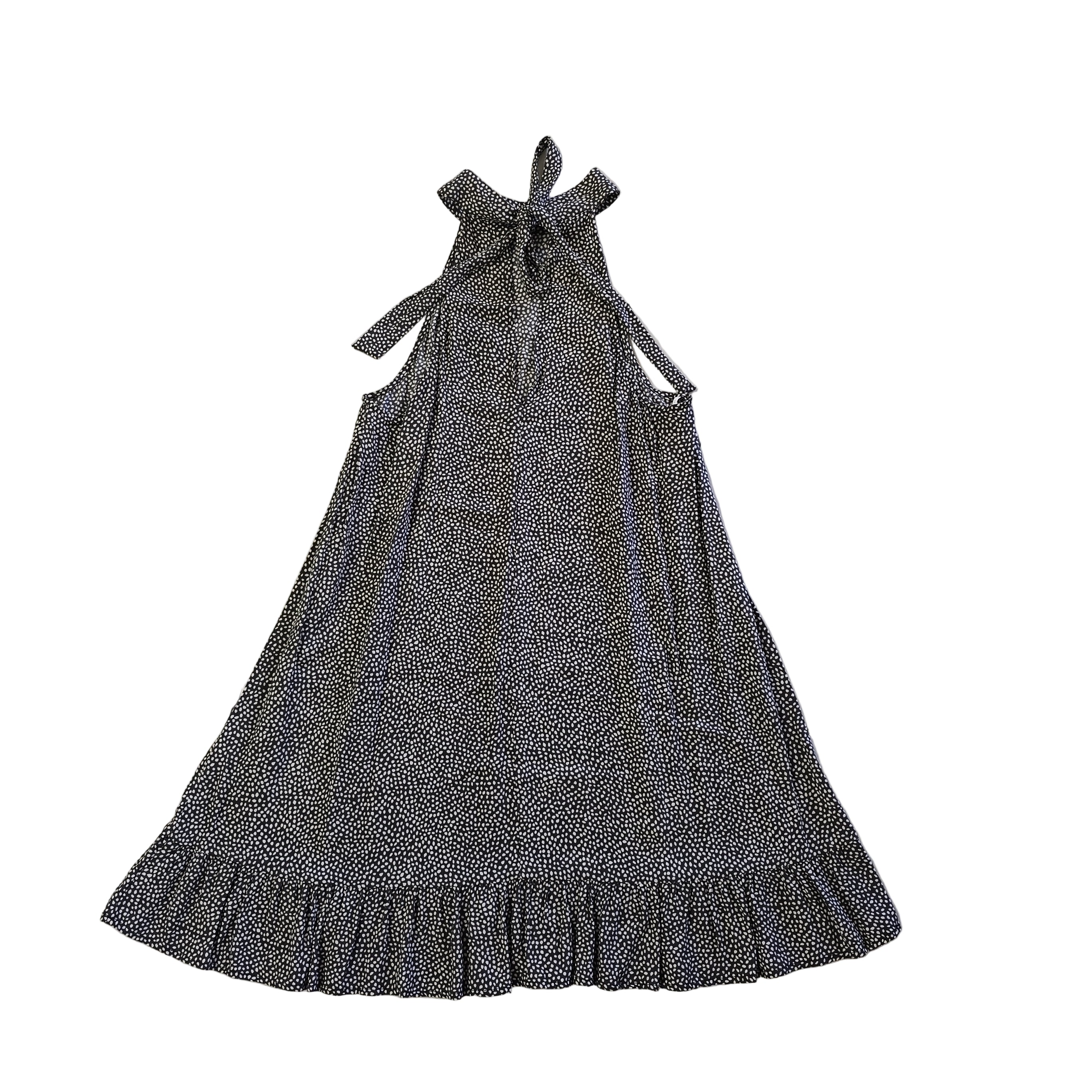 Black and white patterned dress on a tiled floor