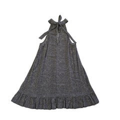 Black and white patterned dress on a tiled floor