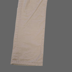 Beige pants on a tiled floor