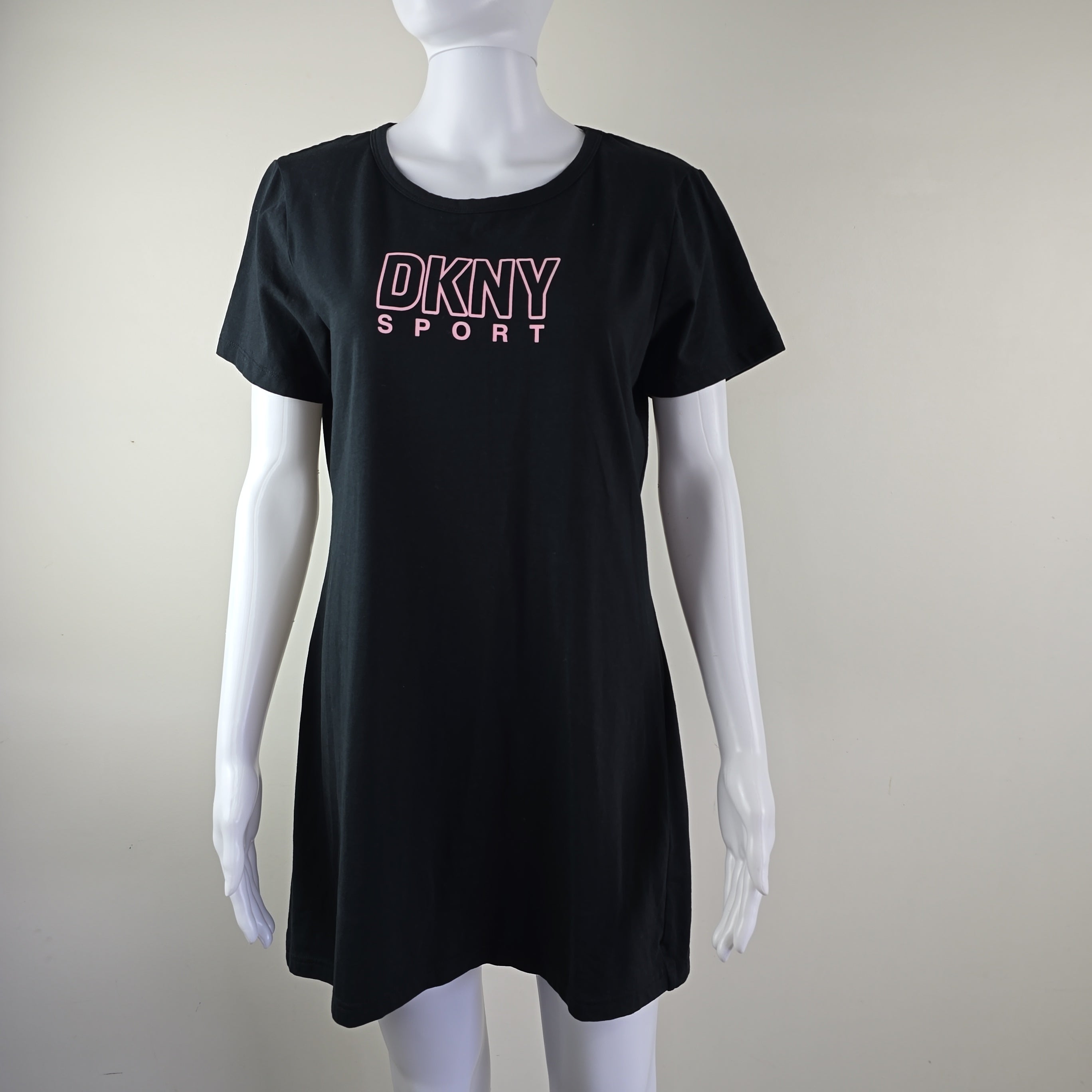 Black DKNY Sport dress on a mannequin against a plain background