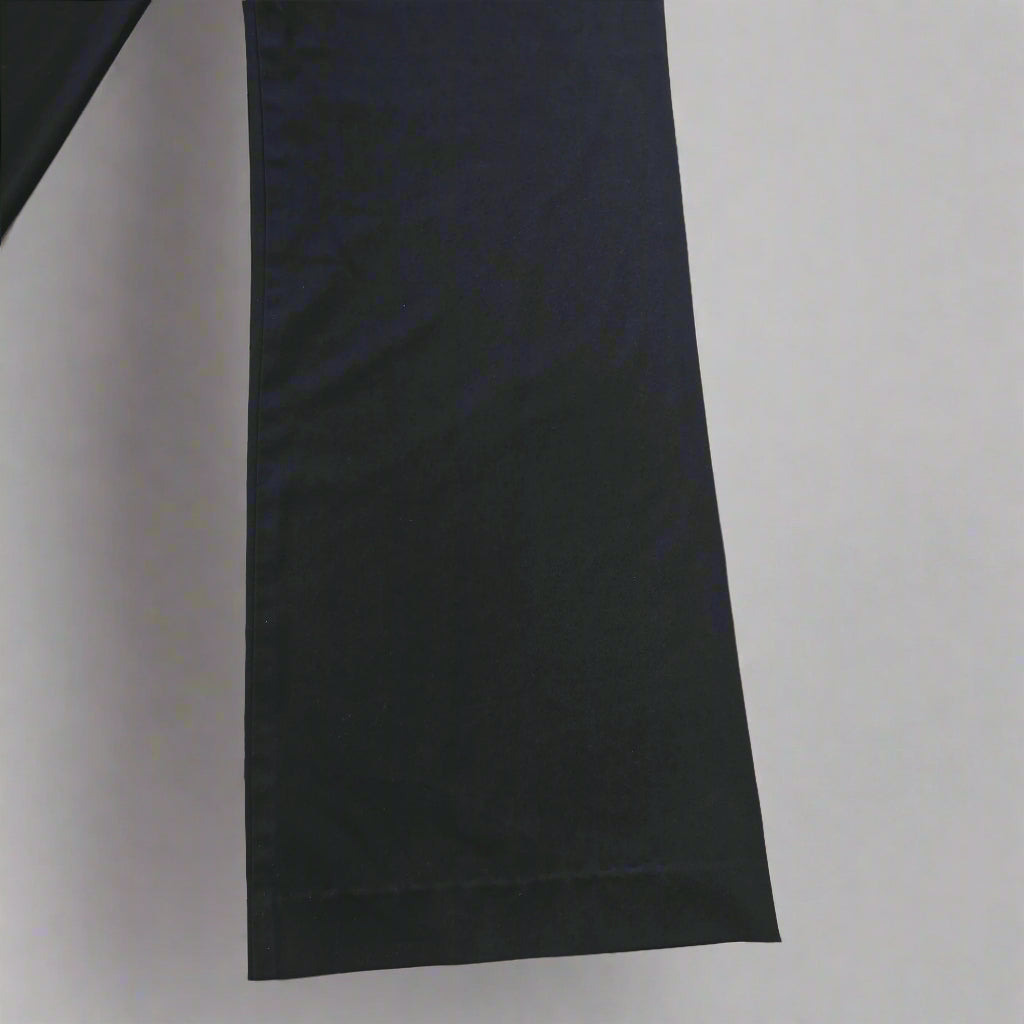 Black Pants on a tiled floor