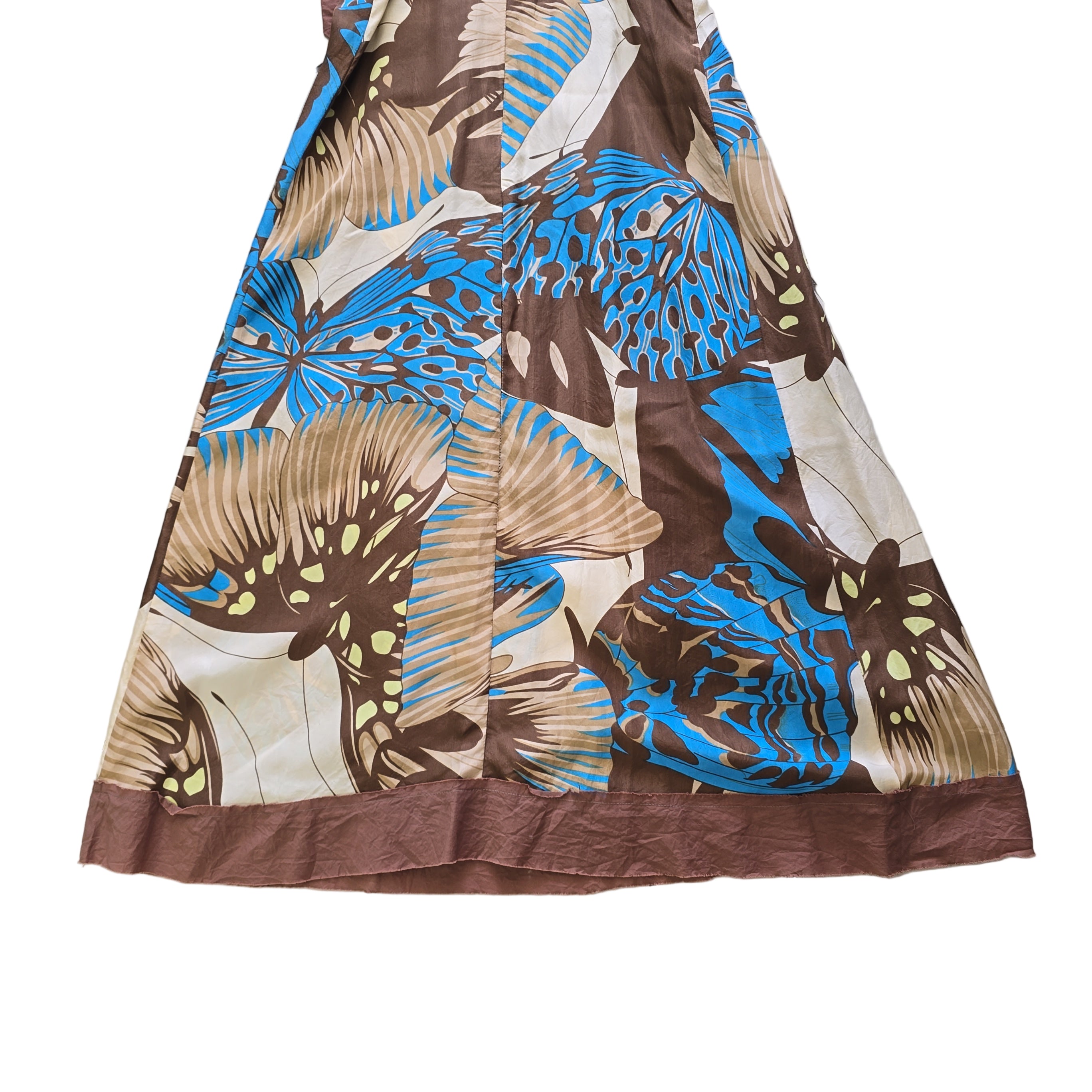 Dress with blue and brown butterfly pattern on a tiled floor