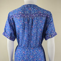 Blue patterned shirt against a beige background