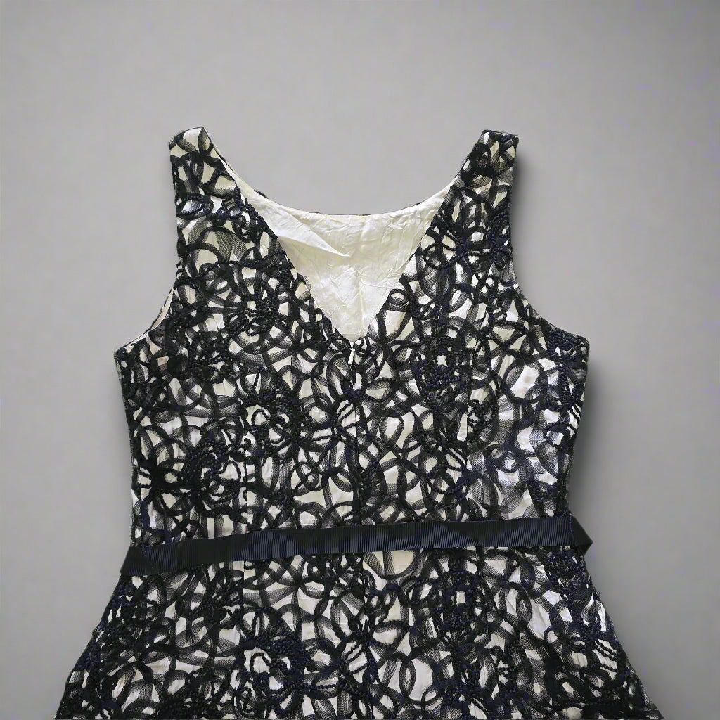 Black lace lingerie set on a tiled floor