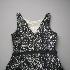 Black lace lingerie set on a tiled floor