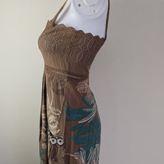 Brown embroidered fabric on a gray background