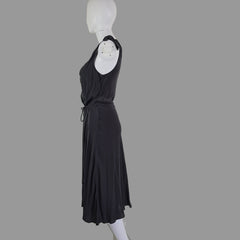 Grey dress on a mannequin against a plain background