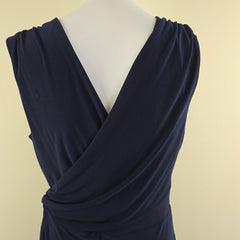 Navy blue dress on a light gray background