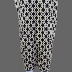 Black and white patterned skirt against a white wall