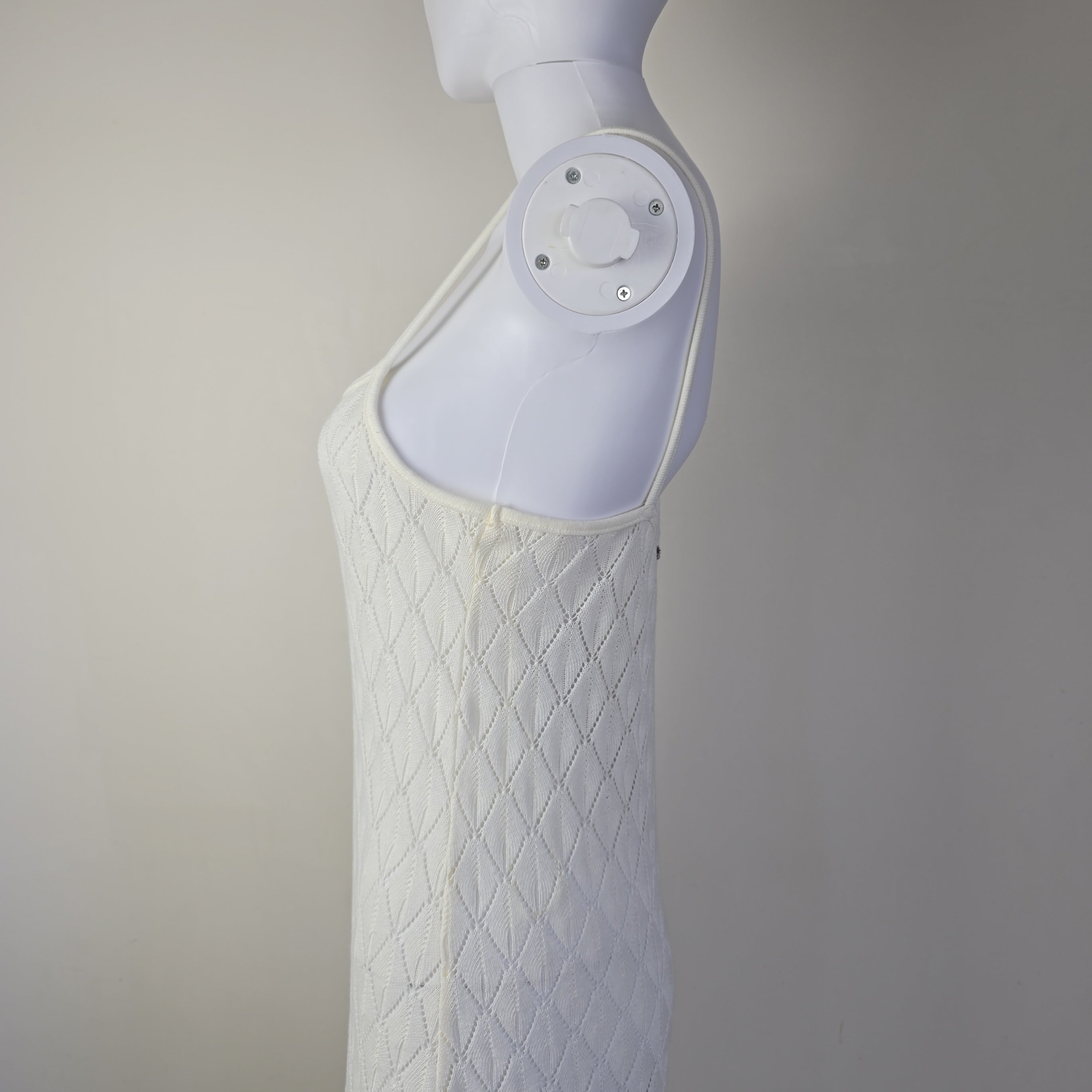 White textured dress on a light background.