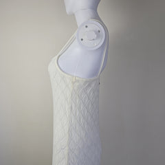 White textured dress on a light background.