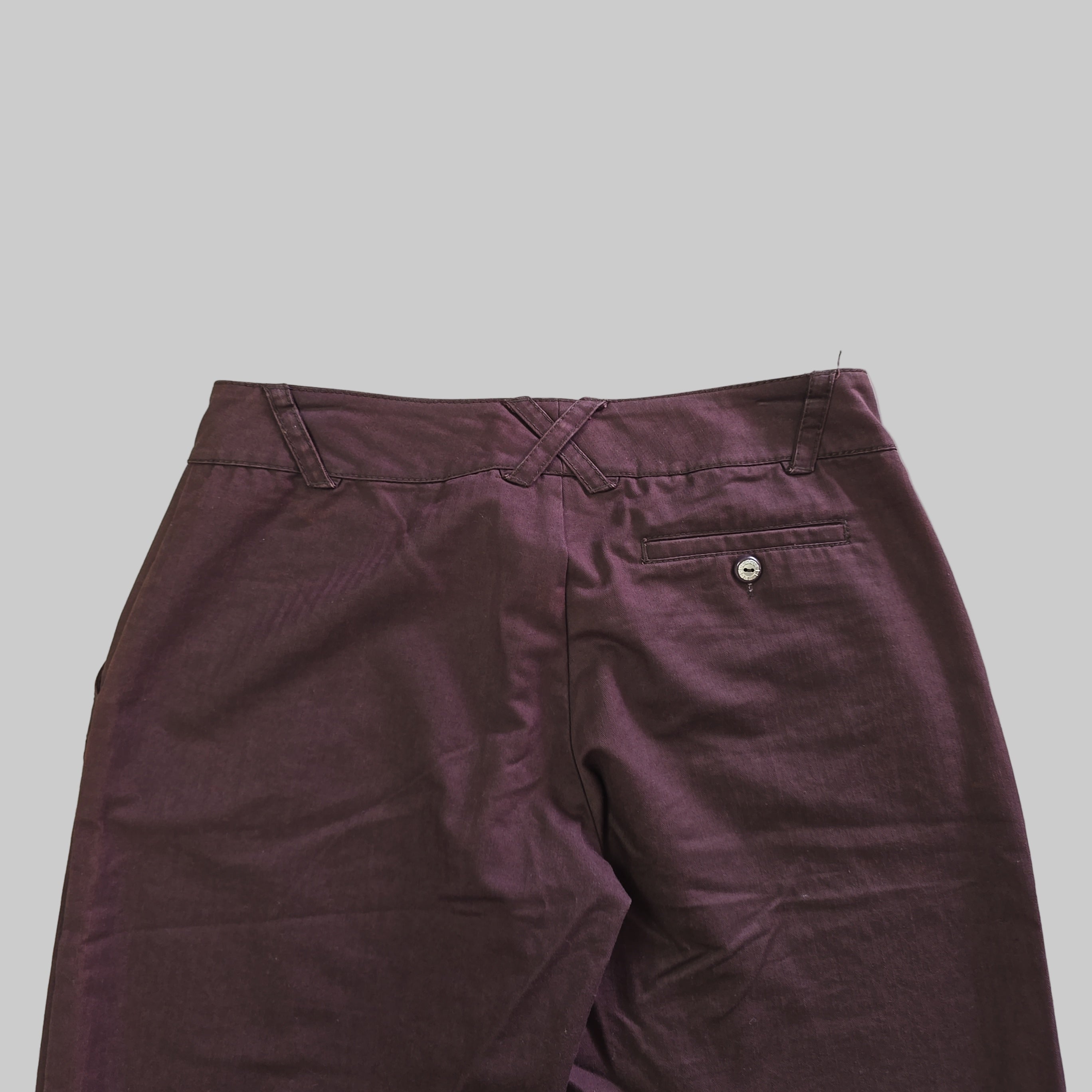 Purple pants on a tiled floor