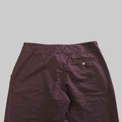 Purple pants on a tiled floor