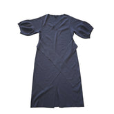 Grey dress on a tiled floor