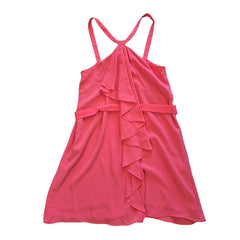 Pink dress with ruffled details on a light background