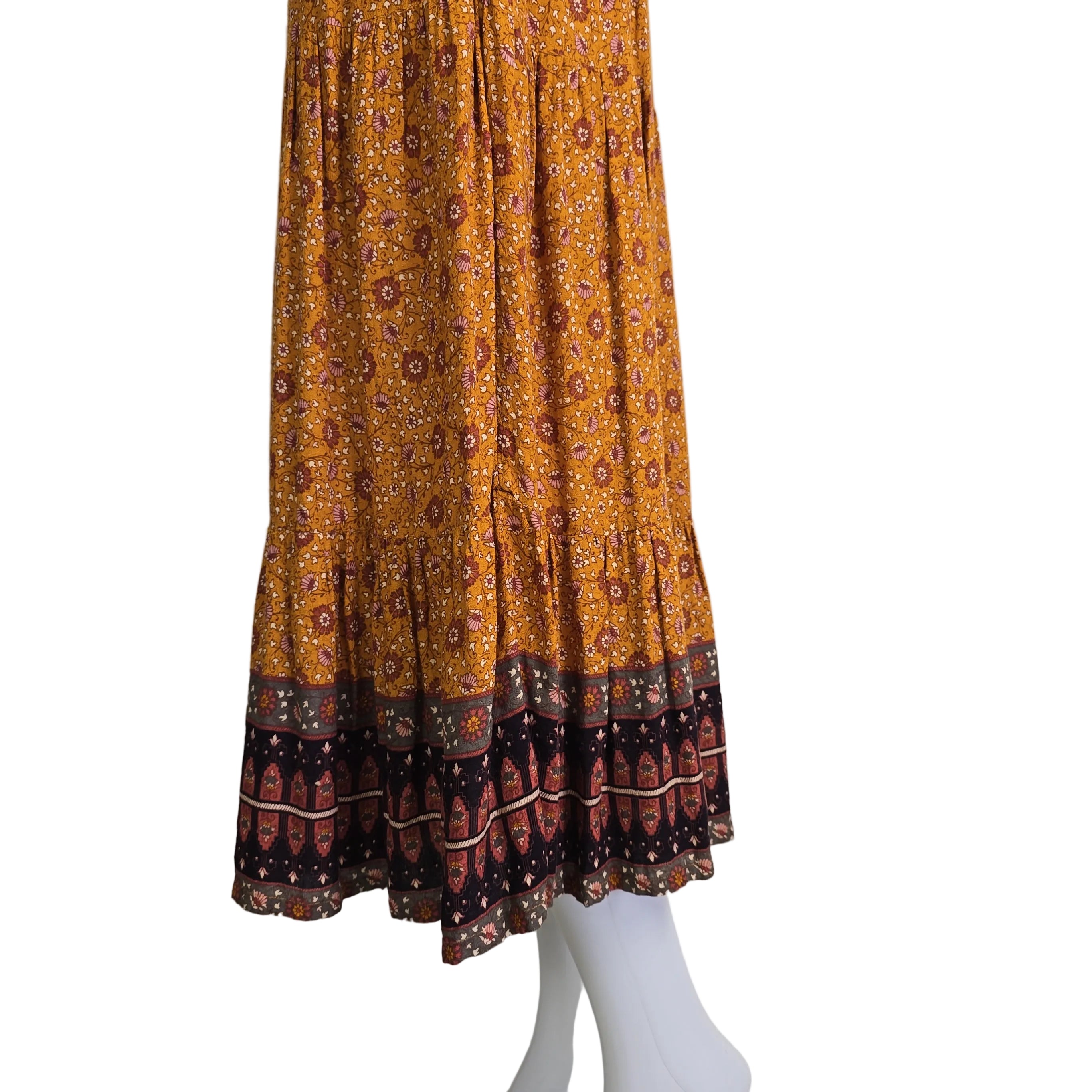 Bunch of orange and brown patterned fabric on a white background