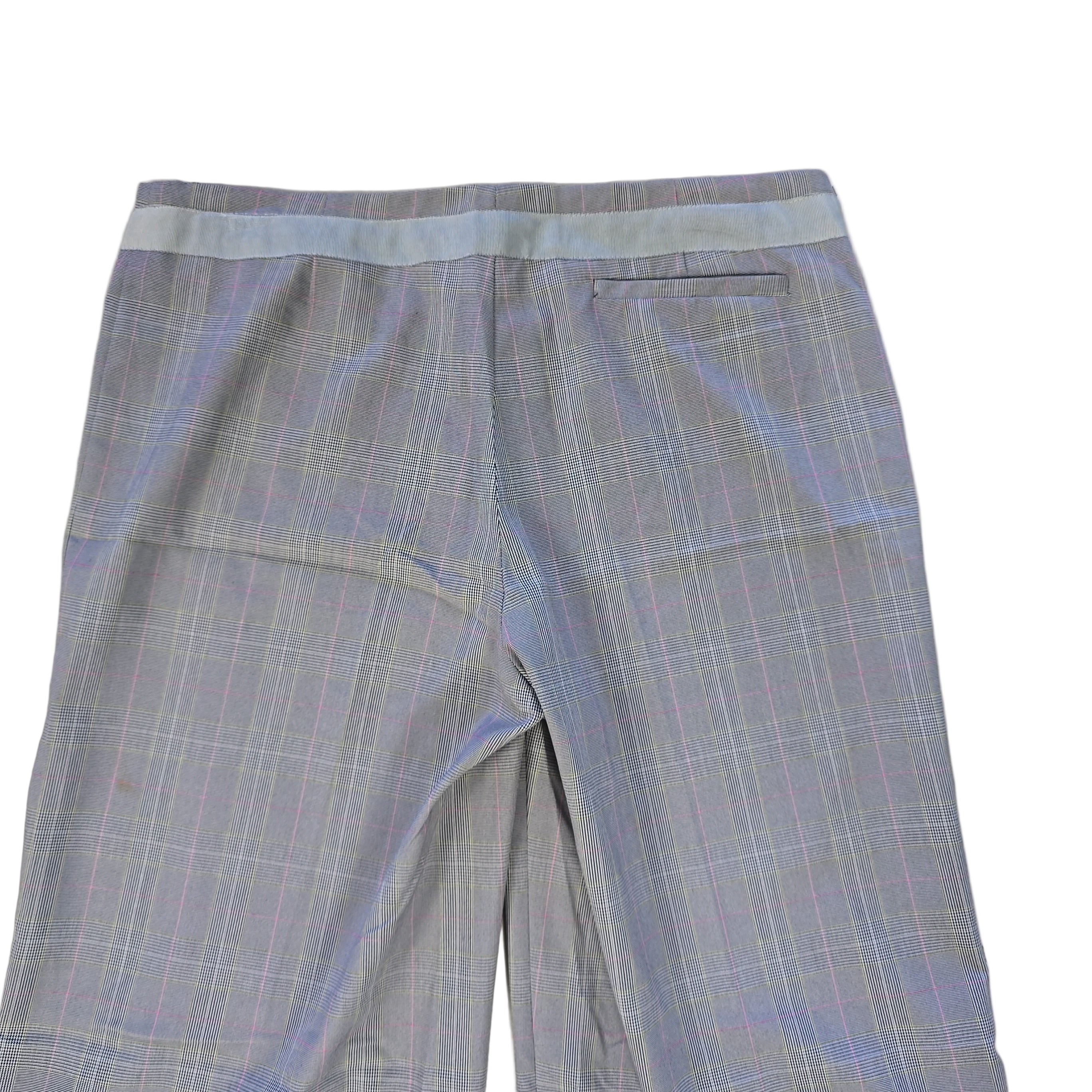 Light grey checkered pants on a tiled floor