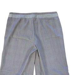 Light grey checkered pants on a tiled floor