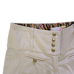 Beige pants with gold buttons on a white background