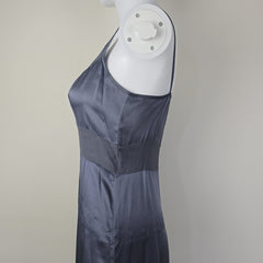 Grey dress with black floral patterns on a light background.