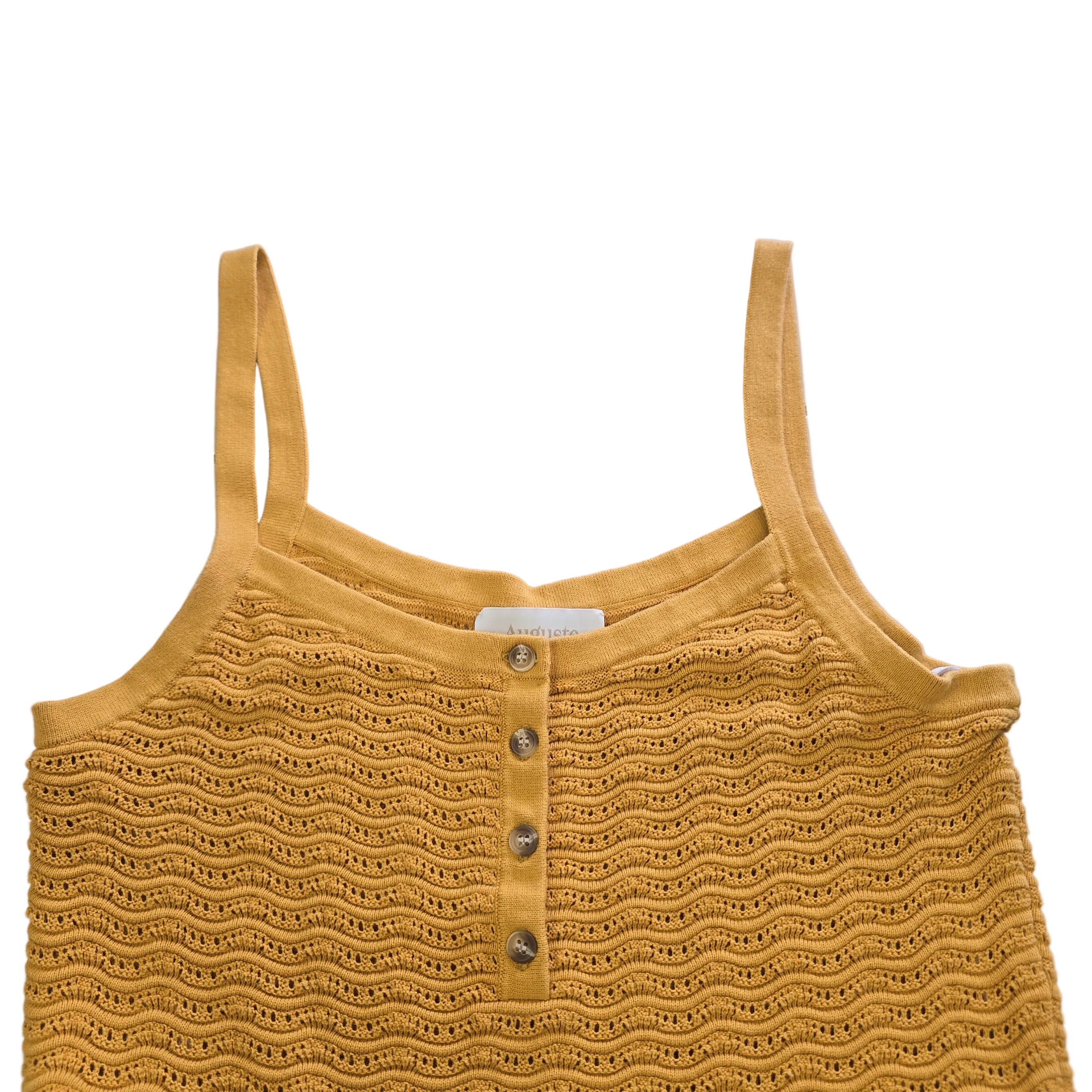Yellow knitted tank top on a light background