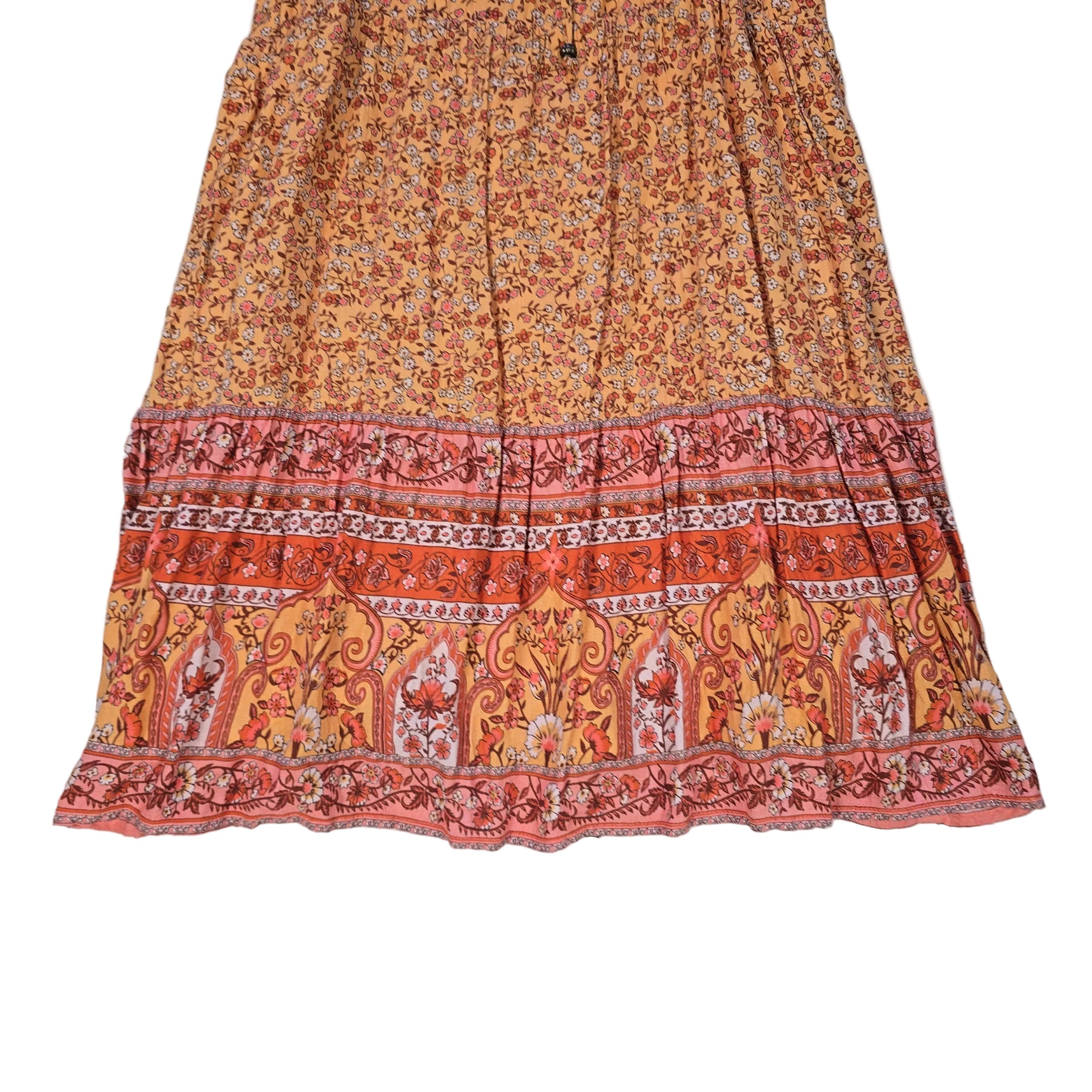 Orange patterned dress on a light background