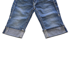 Pair of blue jean shorts on a light background