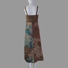 Brown floral dress on a mannequin against a white background