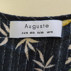 Fabric with a floral pattern and an Auguste label on a beige background