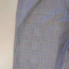 Plaid fabric with blue and pink lines on a plain background