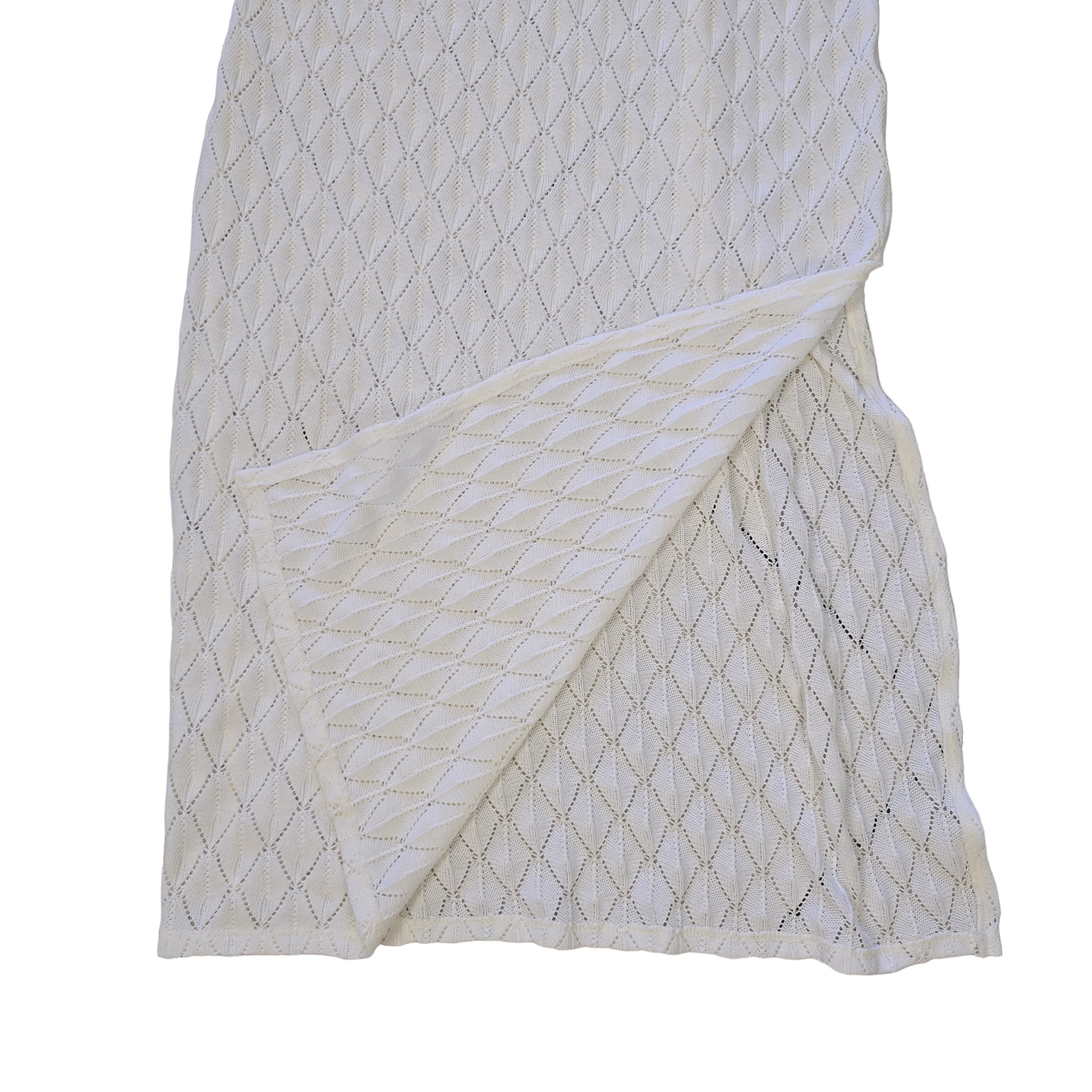 White textured dress on a light background.