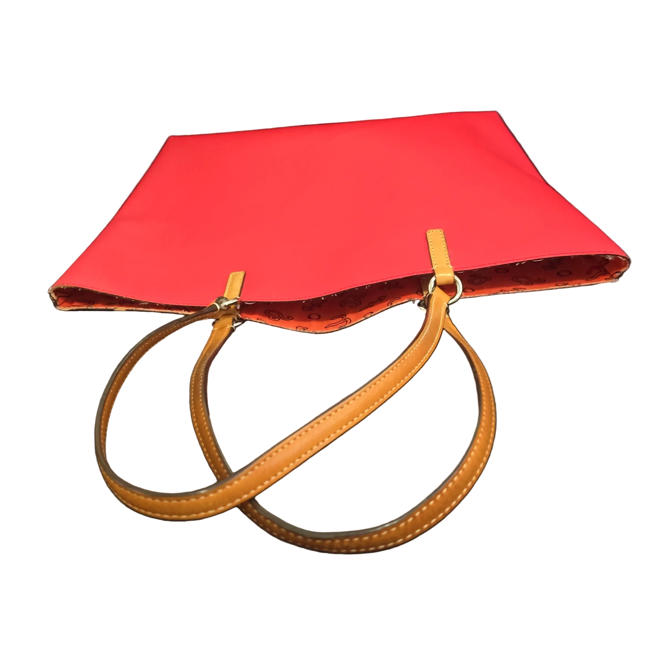 Red handbag with a brown strap on a light background