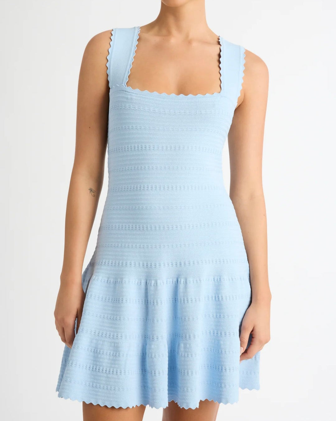 Light blue sleeveless dress on a white background