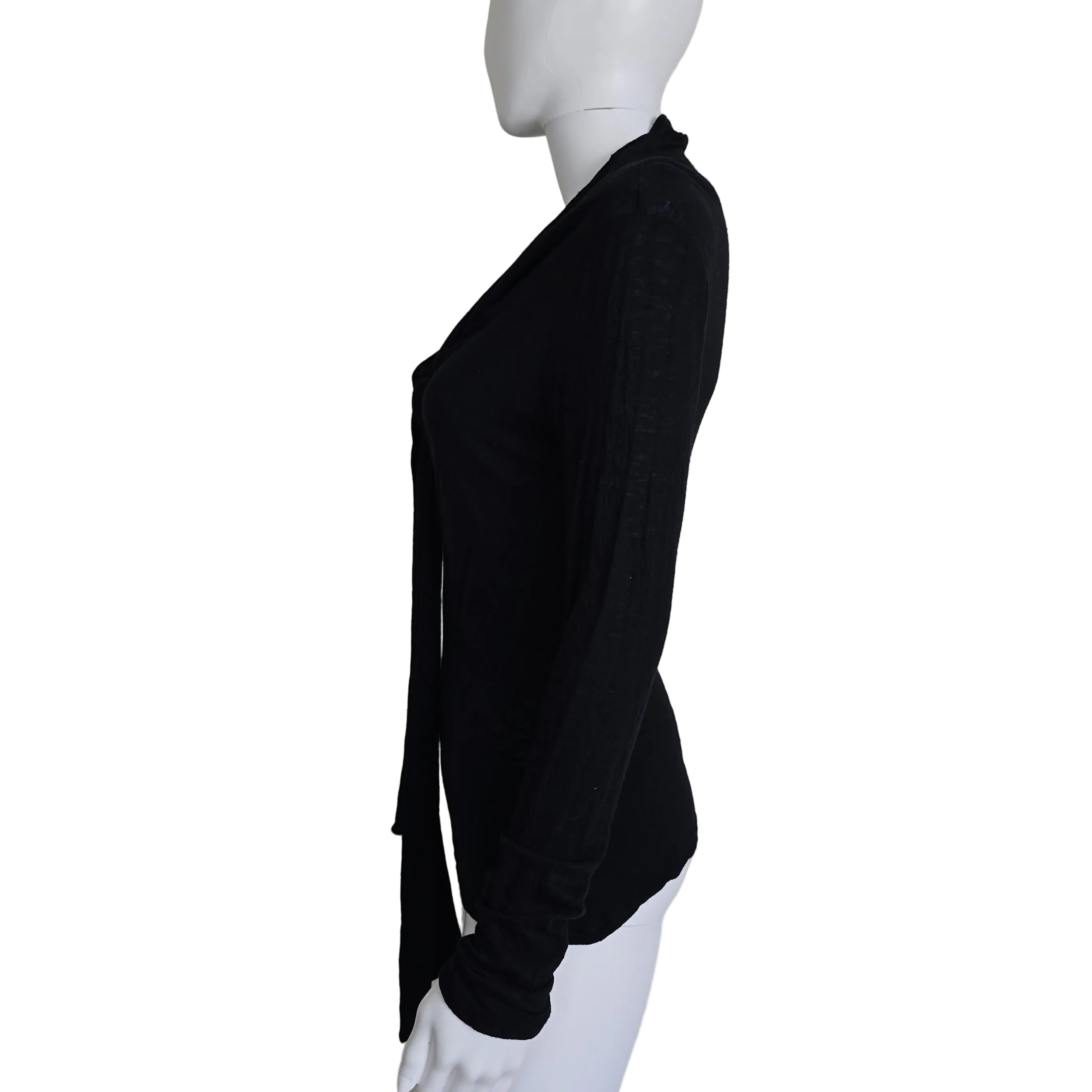 Black top with tie detail on a light background