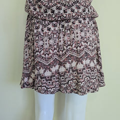 Patterned fabric on a mannequin with a plain background