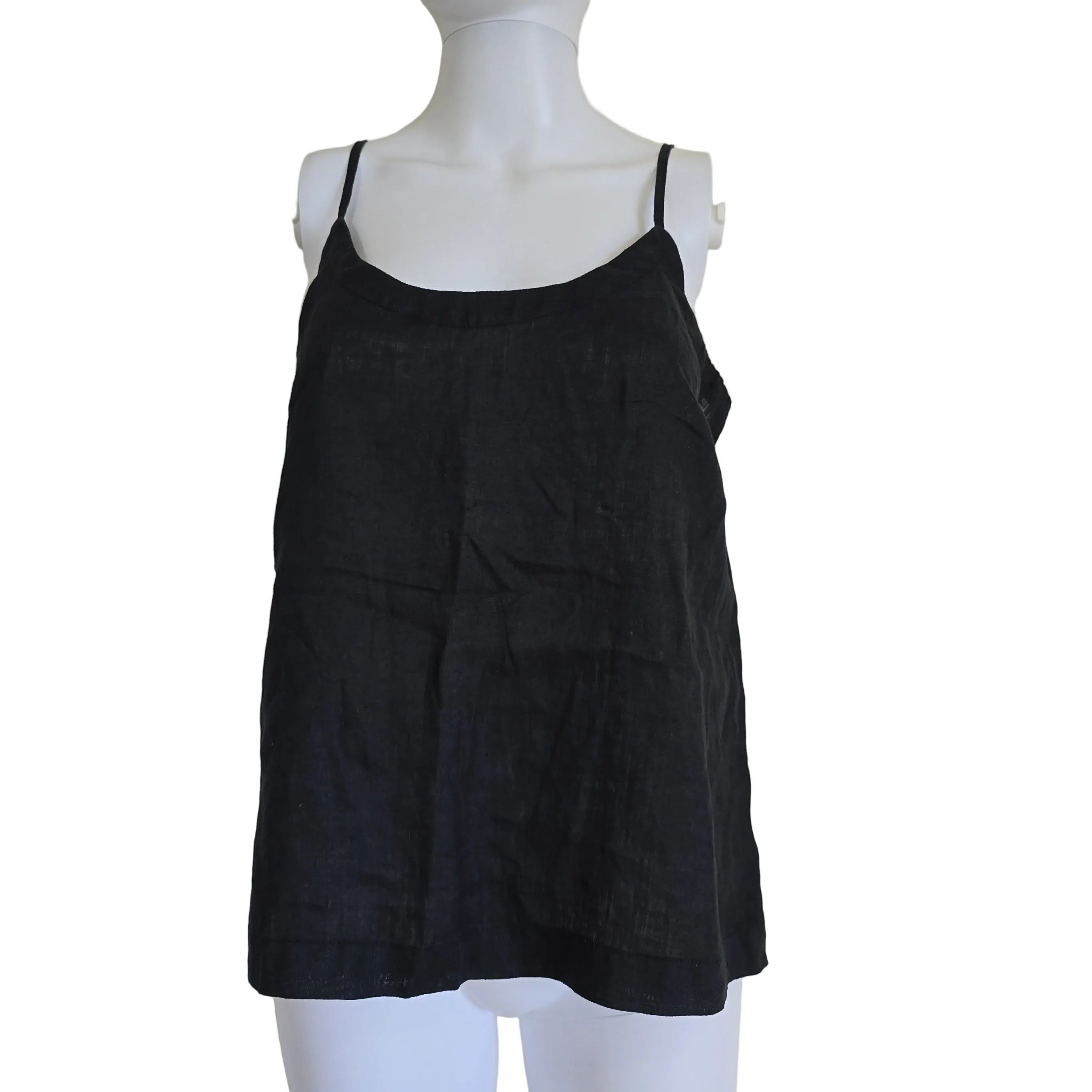 Black top on a mannequin against a light background