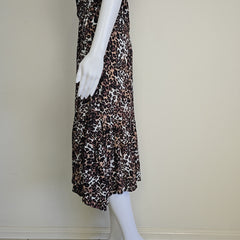 Leopard print dress on a mannequin against a plain background