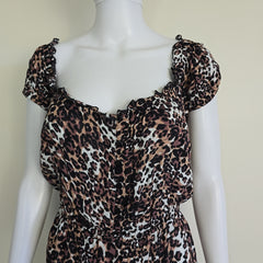 Mannequin wearing a leopard print outfit with a beige background