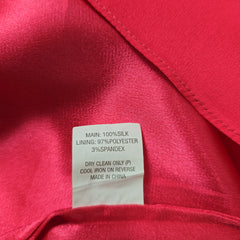 Close-up of a red fabric with a label on it