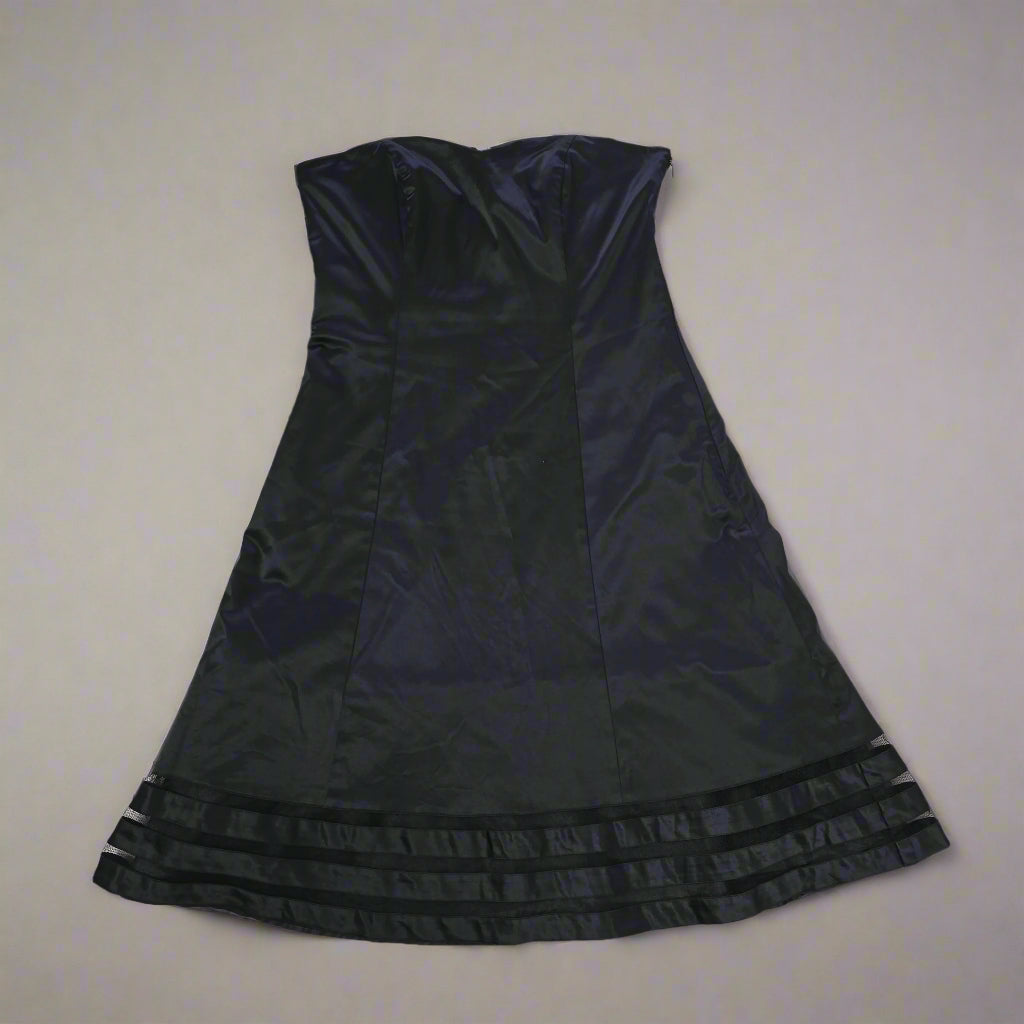 Black dress on a tiled floor