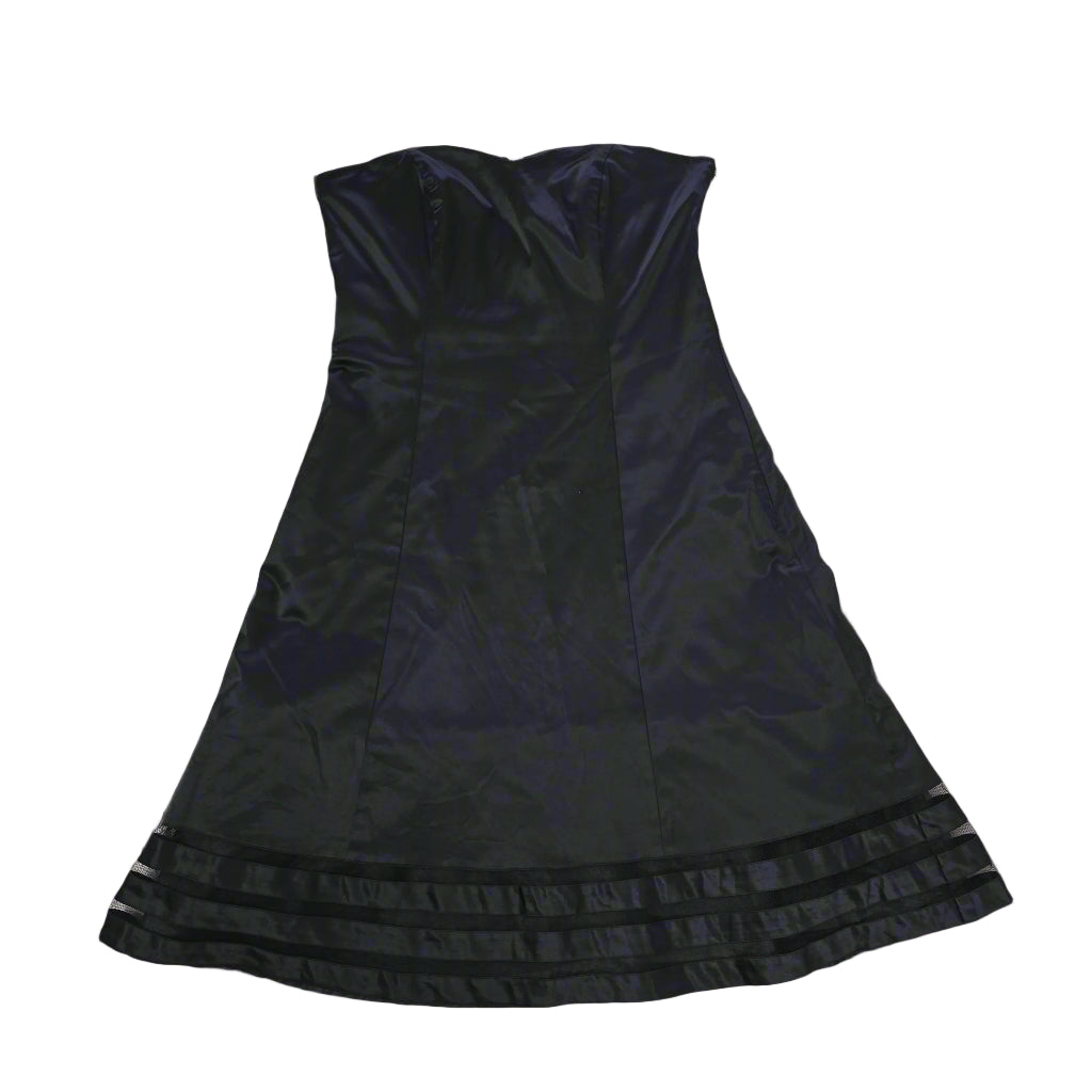 Black dress on a tiled floor