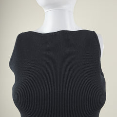 Close-up of a black textured sleeveless top on a beige background
