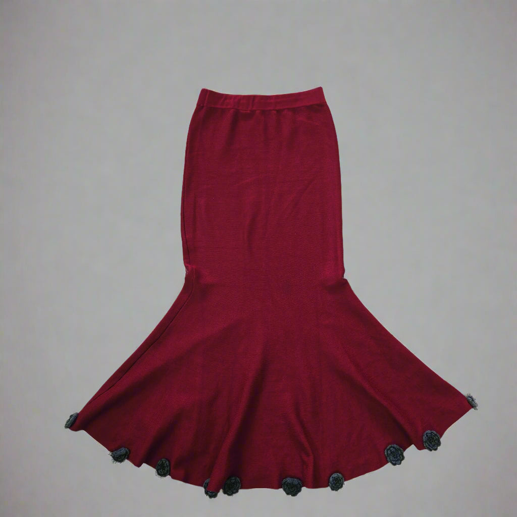 Red skirt with black accents on a plain background