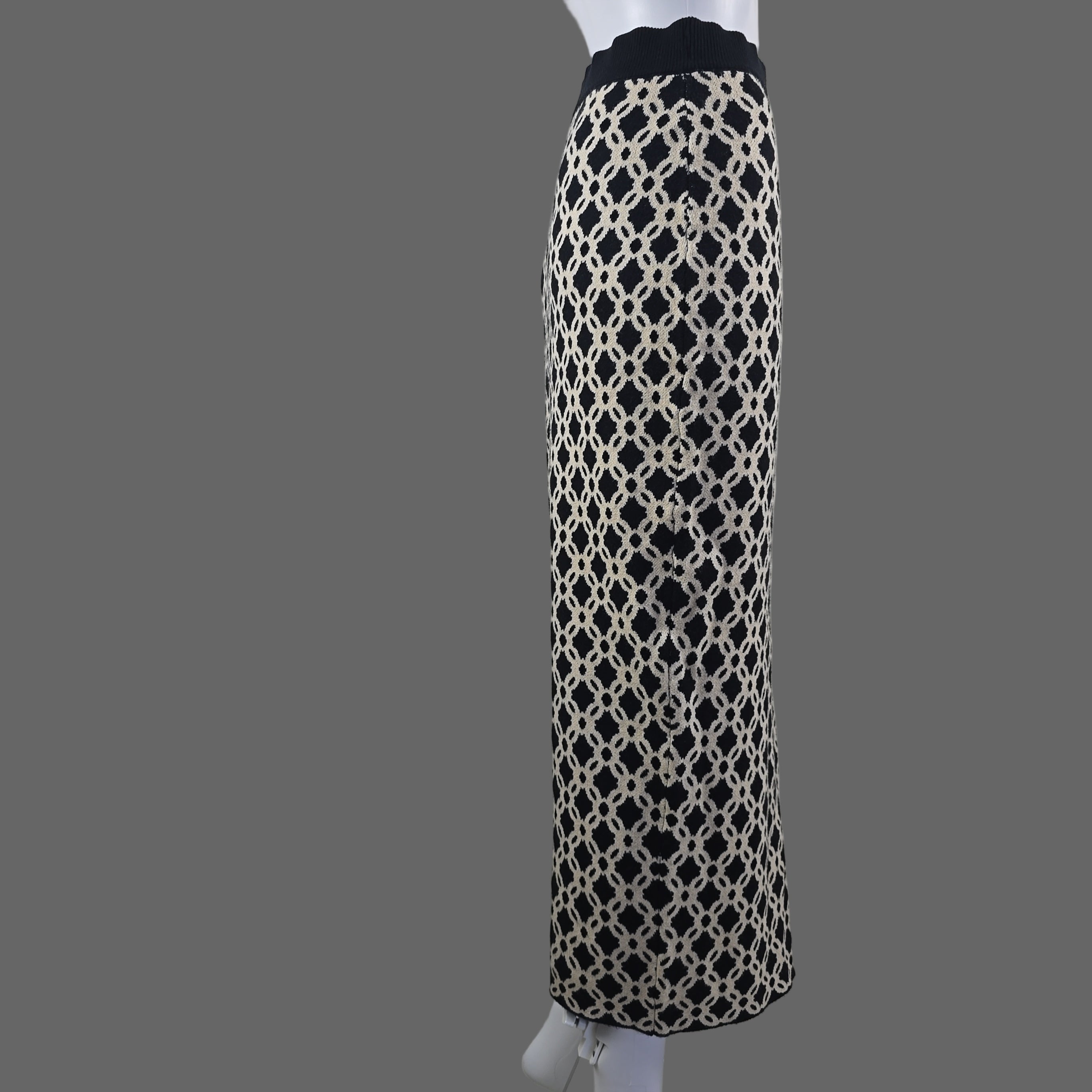 Black and white patterned skirt on a white surface.