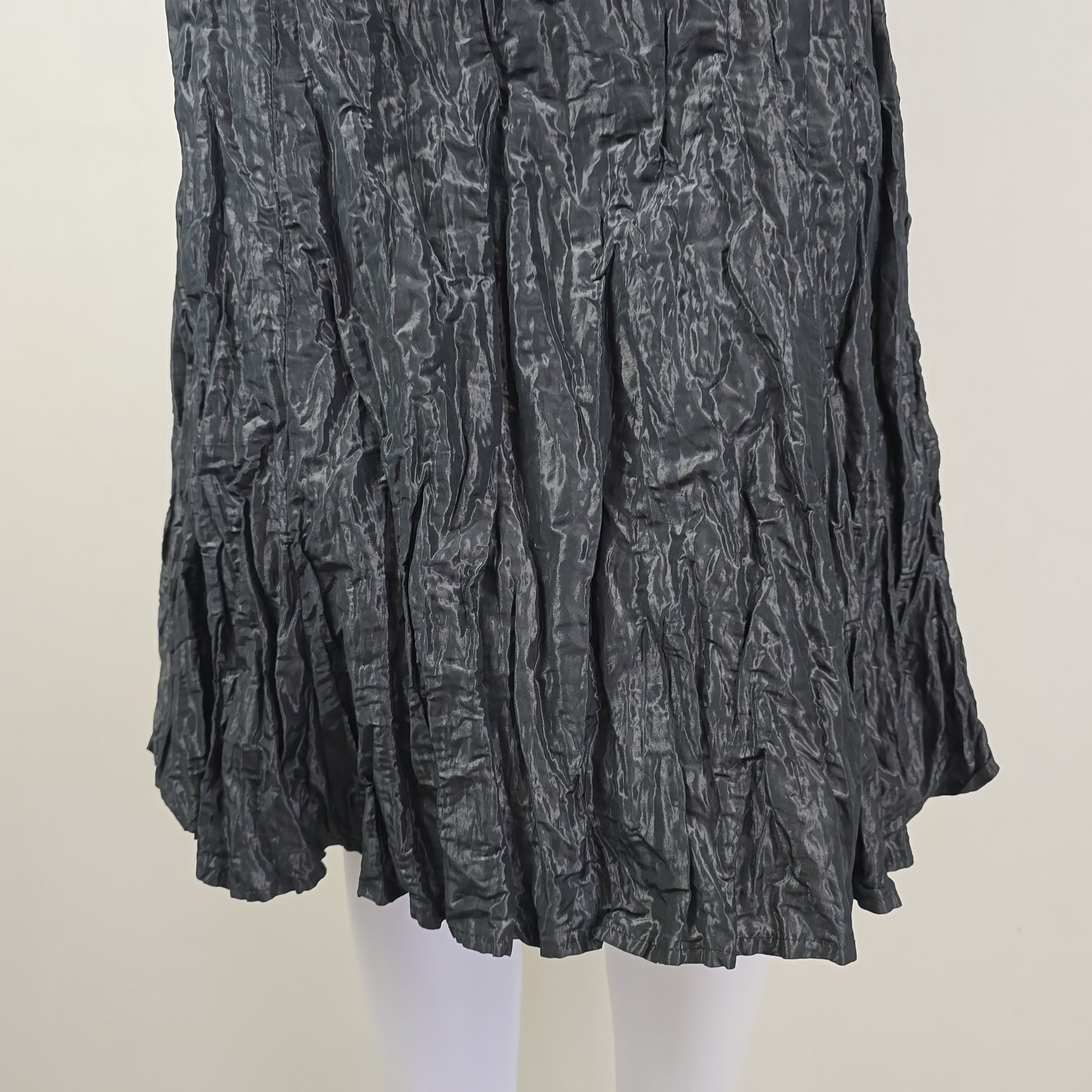 Crumpled black skirt on a white background