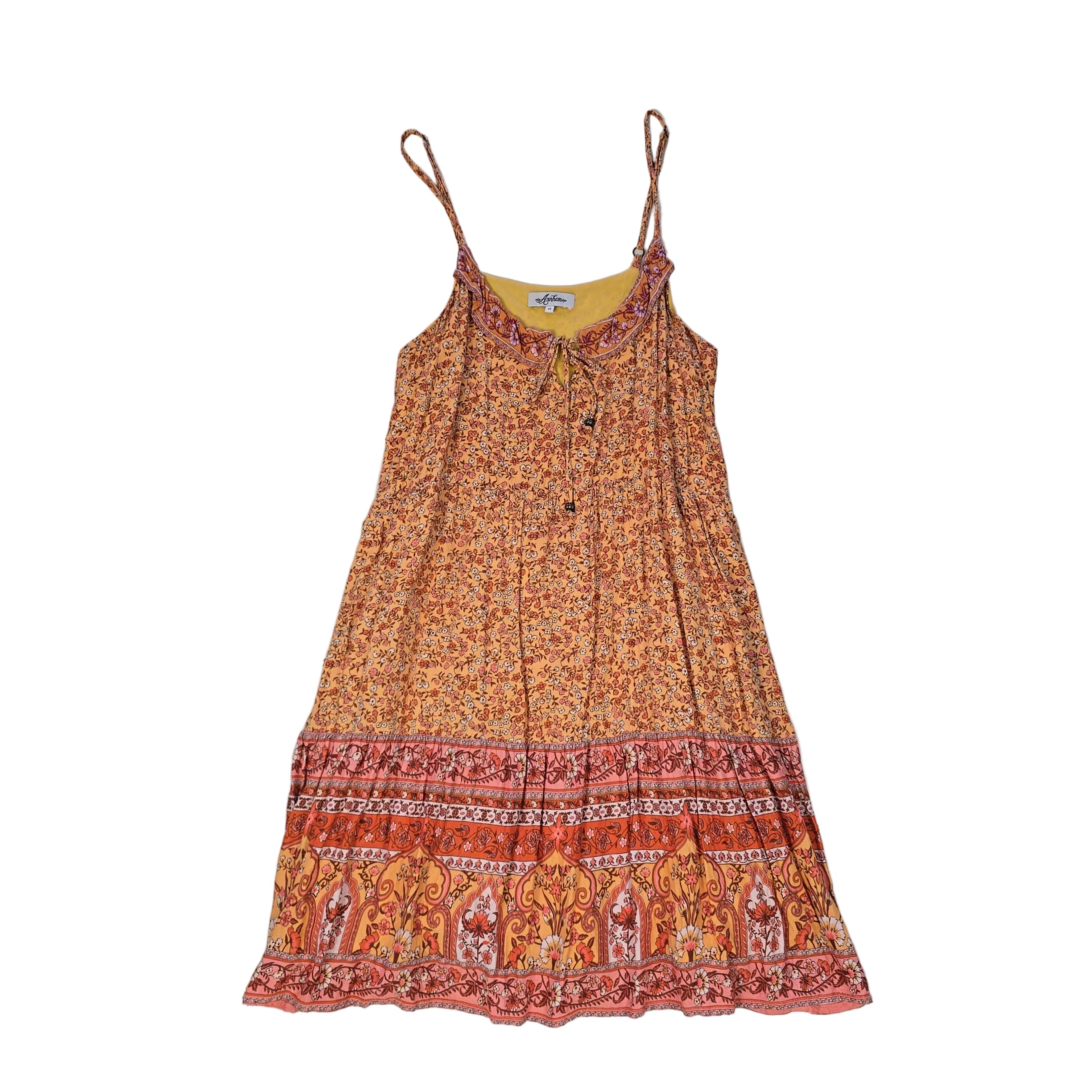 Orange patterned dress on a light background