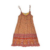 Orange patterned dress on a light background