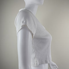 White mannequin with a textured top on a plain background