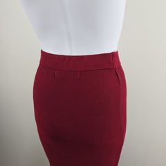 Close-up of a red garment on a mannequin with a neutral background